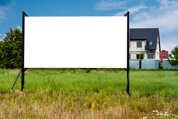 Blank white billboard mockup in the front of house under construction in the suburbs - obrazy, fototapety, plakaty