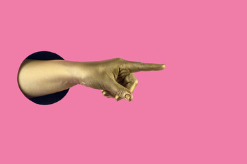 Hand painted in gold shows different gestures and symbols from the hole on a pink pastel paper background.