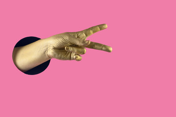 Fototapeta premium Hand painted in gold shows different gestures and symbols from the hole on a pink pastel paper background.