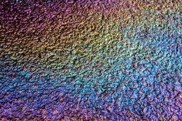 Obraz premium Petrol Oil Pollution Rainbow Gasoline Leak on Pavement