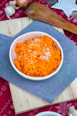 Carrot style with sesame seeds on top.
