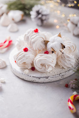 White zephyr on grey concrete background. Set of homemade marshmallow Meringue, pansy. Russian sweetness cusine