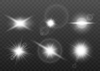 Realistic white sun beam lens flare effect set isolated on dark background