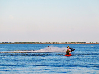 Sports activities on the lake in the recreation center in summer