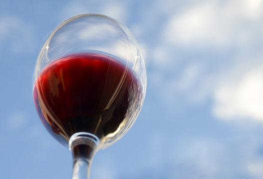 Glass of red wine view from below