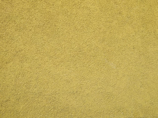 Smooth yellow wall building with visible texture pattern of an outside or inside building wall for cool blank wallpaper or background