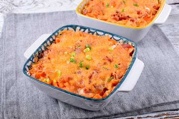 Casserole with sweet potato and cheese in a one portion baking dish