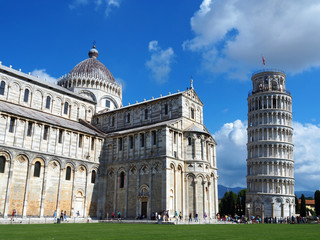 View of the Pisa Cathedral (Duomo di Pisa) and the Leaning Tower of Pisa (Torre pendente di Pisa) in Pisa, Italy. They are located in Miracoli Square (Piazza dei Miracoli).