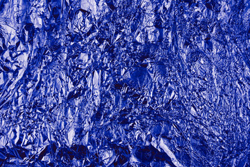 Abstract crumpled foil background. Grunge photo background. Classic Blue