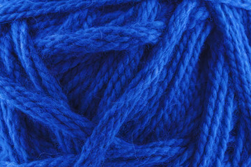 Cozy photo background of large wool yarn. Classic Blue