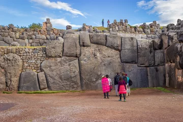 Foto op Canvas Saqsaywaman, Peru - Tourists Visiting Largest Inca Masonry Rock in the Wall at the Saqsaywaman Fortress outside Cuzco © Max Maximov