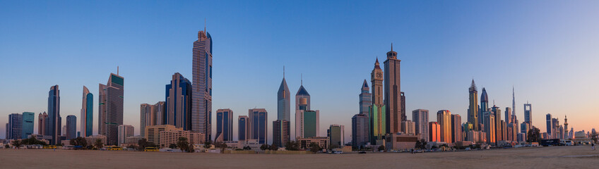 Panorama of Dubai skyline during sunrise