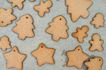 Homemade colorful gingerbread cookies on paper background.