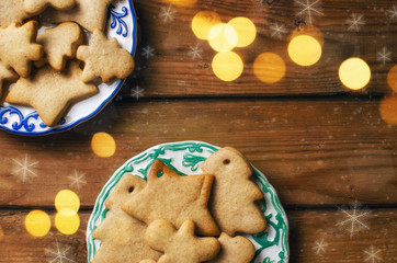 Homemade colorful gingerbread cookies on dark wooden background.