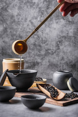 Ceramic tea pot and cups with the famous Photo in the room Chinese tea ceremony on dark background