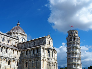 View of the Pisa Cathedral (Duomo di Pisa) and the Leaning Tower of Pisa (Torre pendente di Pisa) in Pisa, Italy. They are located in Miracoli Square (Piazza dei Miracoli).