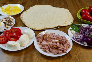 homemade pizza. ingredients, pizza base, tomato sauce