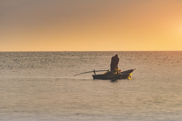 Small fisherman boat in the sea.