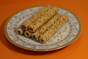 tubes in nuts on a white plate