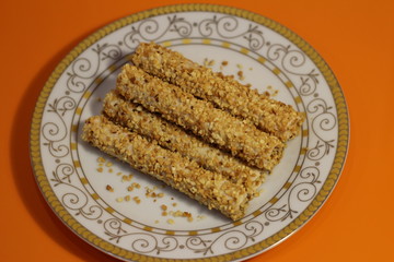 tubes in nuts on a white plate
