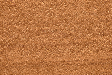 Fototapeta premium orange gravel sand baseball field background pattern closeup