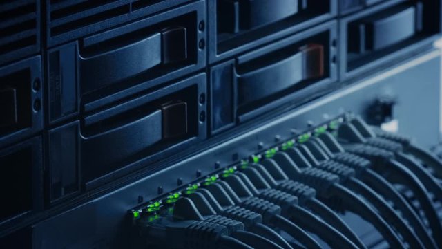 Macro Shot: Ethernet Data Cables Connected to Router Ports with Blinking Lights. Telecommunications: RJ45 Internet Connectors Plugged into Modem LAN Switches. Secure Data Center System Working