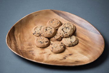 Chocolate chip cookies on an acacia wood platter
