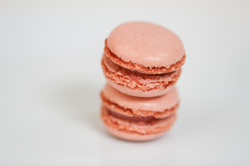 Delicious macaron sweets arranged in rows, colorful macaroon dessert on white background. -Image