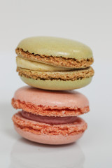 Delicious macaron sweets arranged in rows, colorful macaroon dessert on white background. -Image