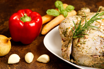 Pickled chicken with vegetables. Marinated grill a hen with carrots, peppers, onions, basil and rosemary.