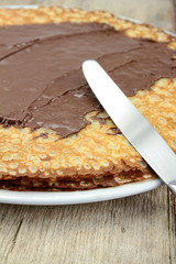 bunch of pancakes with chocolate spread