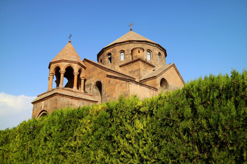 Fototapeta na wymiar Saint Hripsime Church with the Evergreen Shrubs in Foreground, Vagharshapat City, Armenia