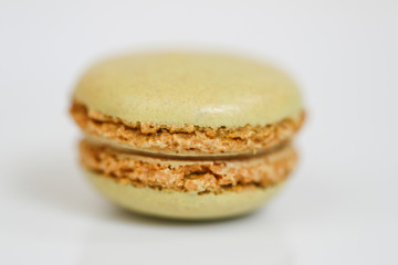 Delicious macaron sweets arranged in rows, colorful macaroon dessert on white background. -Image