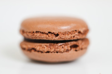 Delicious macaron sweets arranged in rows, colorful macaroon dessert on white background. -Image