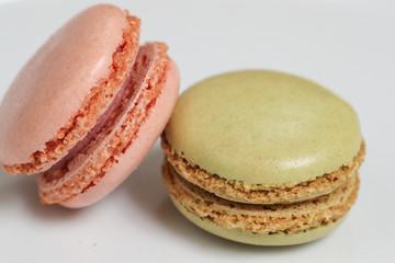 Delicious macaron sweets arranged in rows, colorful macaroon dessert on white background. -Image