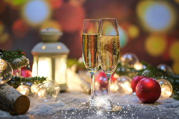 glasses with champagne against the background of New Year's decoration