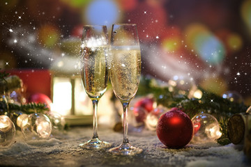 glasses with champagne against the background of New Year's decoration © ZoomTeam