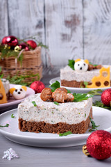 Salty cheesecake garnished with roasted champignons. New Year 2020 appetizer with mice of quail eggs, symbol of the new year