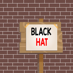 Text sign showing Black Hat. Business photo showcasing used in reference bad demonstrating especially a villain or criminal Wood plank wooden stick pole paper note attached adhesive tape empty space