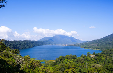 Fototapeta na wymiar View of lake Buyan (Danau Buyan) from the top. Landscape with lake and mountain views. Bedugul, Buleleng, Bali, Indonesia.