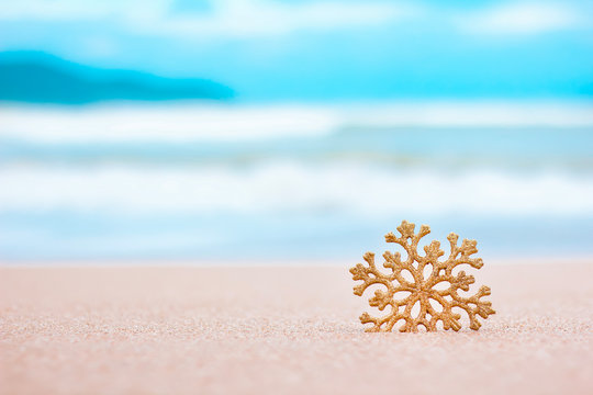 Merry christmas and happy new year. Christmas decorations on the sea sandy beach - winter holidays in the tropics, New Year holiday concept. Copy space