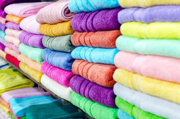 Colorful towels on the shelf in the store