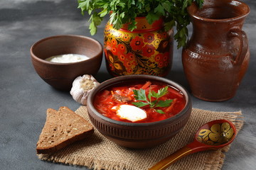 Traditional Ukrainian Russian borscht . Bowl of red beet root soup borsch with white cream . Beet Root delicious soup . Traditional Ukrain food cuisine 