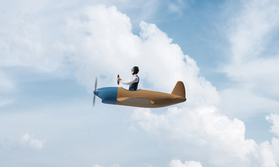 Young man in aviator hat with goggles