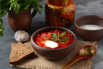 Traditional Ukrainian Russian borscht . Bowl of red beet root soup borsch with white cream . Beet Root delicious soup . Traditional Ukrain food cuisine 