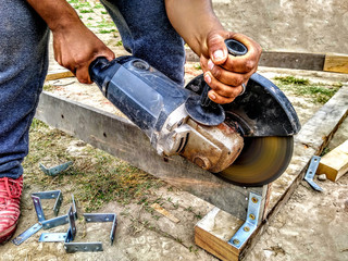 Close up wood cutter with fire sparks with man working