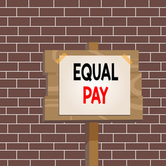 Text sign showing Equal Pay. Business photo showcasing Rights that individuals in the same workplace be given equal pay Wood plank wooden stick pole paper note attached adhesive tape empty space
