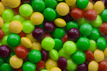 Background made of colorful dragee. A lot of round candies.