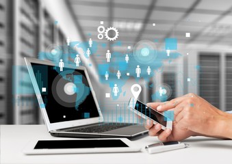 Business man hands using mobile and laptop