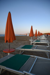 Umbrellas on the Beach at Sunset by Summer